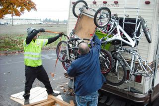 Tom Henderson/News-Register##Omar Gonzalez of Gales Towing & Recovery in McMinnville, left, gets some help from Frank Cochrane as he prepares to tow Cochrane s RV off Marsh Lane. The RVs along the street had to leave Tuesday so McMinnville Water & Light crews would install new street lights. Tom Henderson/News-Register##Omar Gonzalez of Gales Towing & Recovery in McMinnville, left, gets some help from Frank Cochrane as he prepares to tow Cochrane s RV off Marsh Lane. The RVs along the street had to leave Tuesday so McMinnville Water & Light crews would install new street lights.
