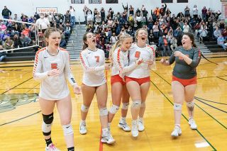 Marcus Larson/News-Register##
Willamina players, from left, Hallee Hughes, Sylvie Berry, Grace France, Madi Diehl and Jacey Smith celebrate along with the crowd moments after their first round playoff victory over Harrisburg.