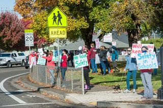 Rusty Rae/News-Register ##
Members of the McMinnville Education Association, representing more than 400 district educators, rallies in front of the McMinnville School District office Friday afternoon. The group met at the Mac Market and then marched to the district office, where teachers heard from McEA leaders and demonstrated to passer-bys before marching back to the Mac Market. Rusty Rae/News-Register ##
Members of the McMinnville Education Association, representing more than 400 district educators, rallies in front of the McMinnville School District office Friday afternoon. The group met at the Mac Market and then marched to the district office, where teachers heard from McEA leaders and demonstrated to passer-bys before marching back to the Mac Market.