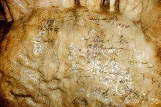 Image: F.J.D. John##The signatures of Thomas Condon and his students, dated 1883, are preserved on a stalagmite deep in the Oregon Caves. They will be visible for hundreds of thousands of years, until the layers of calcite deposited over them become too thick to read through.