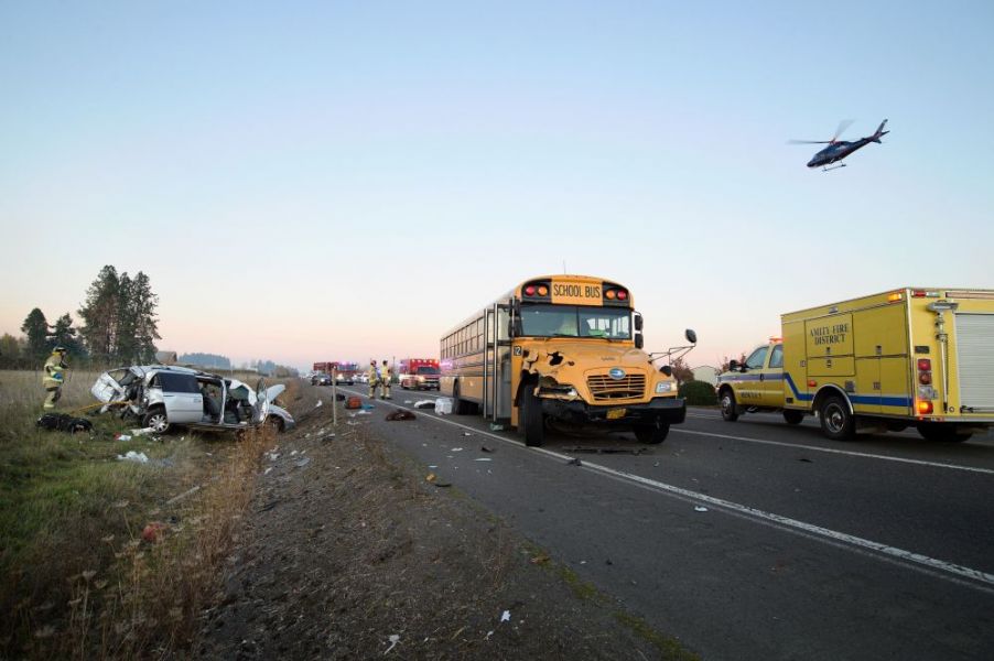 Marcus Larson/News-Register##Life Flight arrives to Durham Road southwest of McMinnville. Occupants of a van that collided with a school bus were seriously injured. No injuries of riders on the bus were initially reported.the scene of a crash Monday evening on Highway 18 near