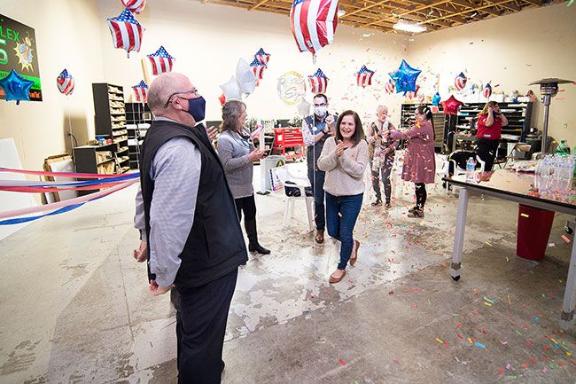 Marcus Larson/News-Register##Scott Hill takes in the moment as friends and family celebrate the initial returns on Election night, showing the mayor with a large lead over challenger Heidi Parker.