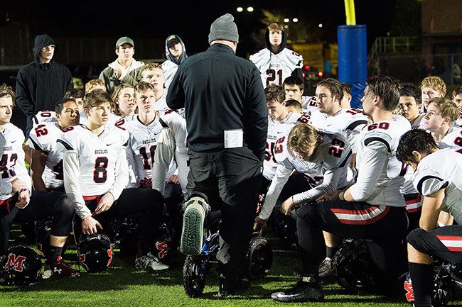 Marcus Larson/News-Register##
McMinnville head coach Ryan McIrvin addresses the team after the Grizzlies first round loss to Grant Friday in the state playoffs. McMinnville fell 47-13.