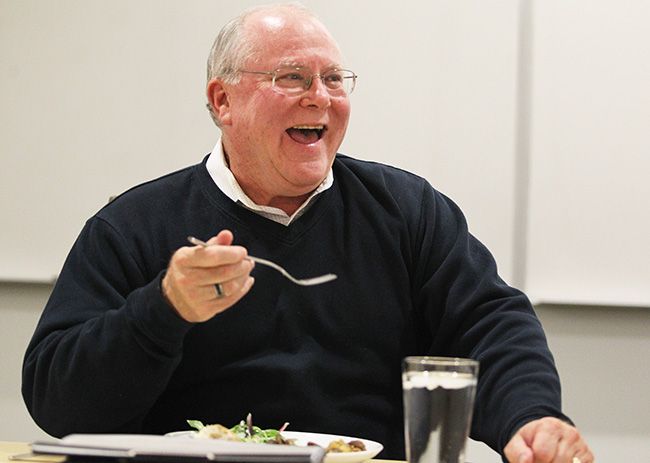 Rockne Roll/News-Register##Scott Hill jokes with fellow McMinnville city councilors during the dinner meeting Tuesday evening.