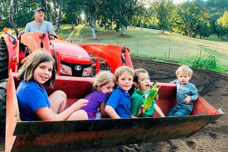 Submitted photo##Grandpa Rick John enjoys spending time on his small “ranch” with his grandkids, from left, Hannah, Lucy, Jackson, Oliver and Kameron.