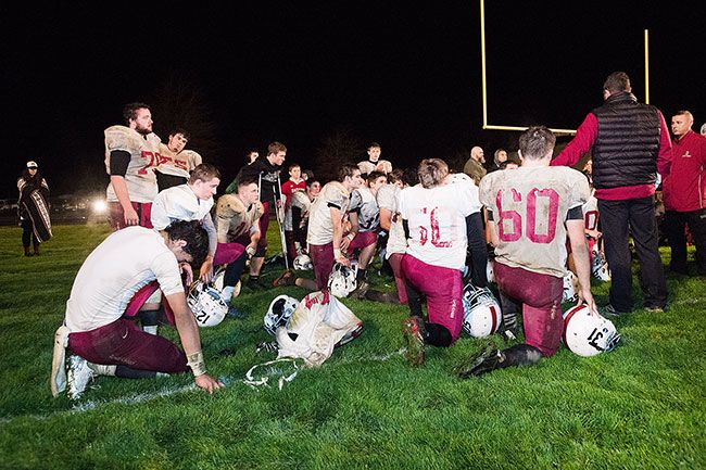 Marcus Larson/News-Register##The Dayton football team gathers following the Pirates  37-34 loss to Harrisburg Friday night in the Class 3A state playoffs.