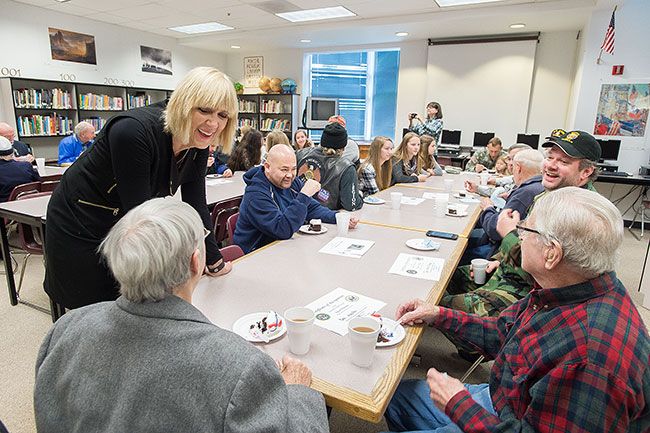 Marcus Larson/News-Register
After the assembly, Duniway Principal Cathy Carnahan and students talked with the veterans in the library about their experiences serving in the military.