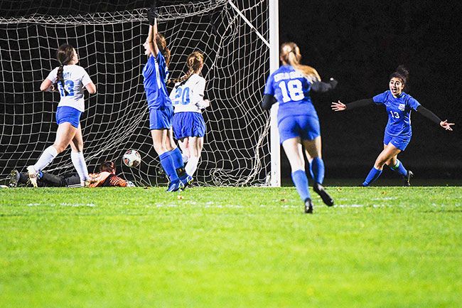 Rusty Rae/News-Register##Catlin Gabel celebrates after another goal, one that helped beat Amity and send the Eagles to their third straight state title game.