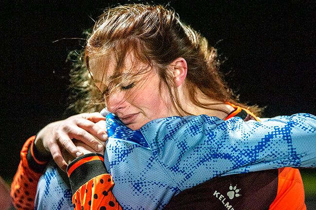 Rusty Rae/News-Register##Amity goalkeeper Kylie Kendall fights back tears while hugging a teammate after the Warriors  6-0 loss to Catlin Gabel in the state semifinals.