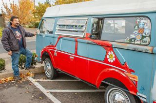 Kirby Neumann-Rean/News-Register##Owner Martin Solano refurbished his specialized 1970 VW Rivera bus and has added touches including leaded stained glass by his mother, Janet Gilmore, to go with Rod Axtell’s profile of a VW Bug.