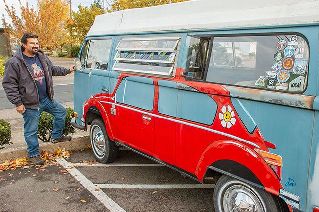 Kirby Neumann-Rean/News-Register##Owner Martin Solano refurbished his specialized 1970 VW Rivera bus and has added touches including leaded stained glass by his mother, Janet Gilmore, to go with Rod Axtell’s profile of a VW Bug.