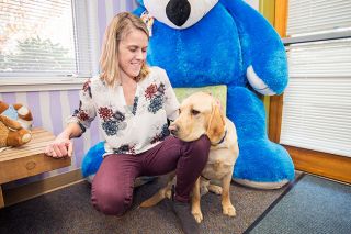 Marcus Larson/News-Register##
Handler Julie Siepmann, an interviewer at the Juliette House s Yamhill County child abuse assessment center, loves working with Mac, the center s facility dog. Mac will be 2 later this month. Marcus Larson/News-Register##
Handler Julie Siepmann, an interviewer at the Juliette House s Yamhill County child abuse assessment center, loves working with Mac, the center s facility dog. Mac will be 2 later this month.