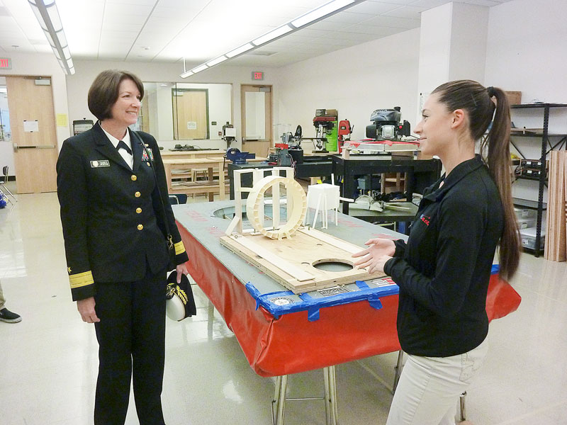 Starla Pointer / News-Register
EASA student Kimberly Goss explains her team s hovercraft project to Rear Admiral Nancy Norton.  It was an amazing opportunity to get to meet her,  said Goss, a senior. She said she was especially impressed by Norton s advice that students take advantage of the amazing opportunities offered by the Engineering and Aerospace Science Academy.