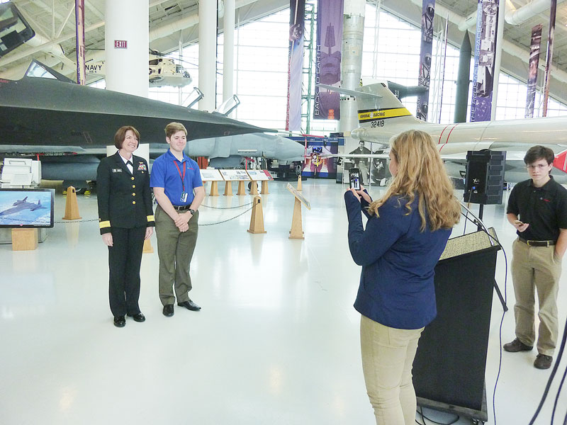 Starla Pointer / News-Register
EASA students take turns snapping photos with Rear Admiral Nancy Norton. 
They also gave the Navy official at tour of their classrooms in the Evergreen Space Museum.