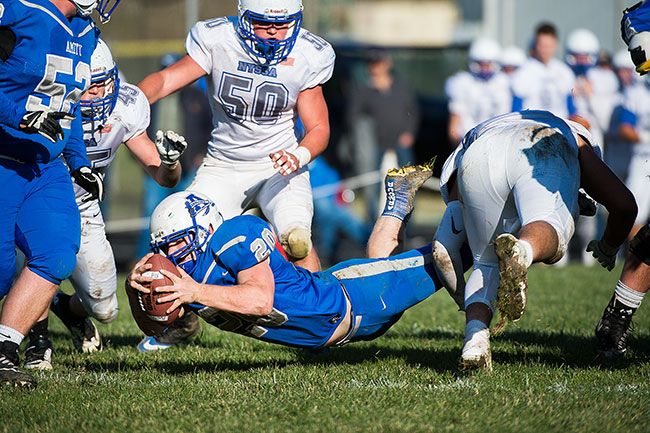 Marcus Larson/News-Register##
Amity running back West Streeter dives into the end zone for the Warriors  third touchdown of the 58-13 victory over Nyssa.