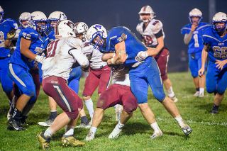 Rusty Rae/News-Register file photo##Dayton defender Tristan McGann and a teammate take down Amity running back Reagan Clark during Dayton’s 56-20 win over the Warriors on Oct. 28. Rusty Rae/News-Register file photo##Dayton defender Tristan McGann and a teammate take down Amity running back Reagan Clark during Dayton’s 56-20 win over the Warriors on Oct. 28.