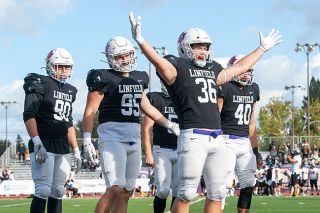 Rachel Thompson/News-Register file photo##Blake Rybar (36) earned the NWC Defensive Player of the Year award. Here, he celebrates during Linfield’s 45-0 win over Pacific Lutheran on Oct. 22.