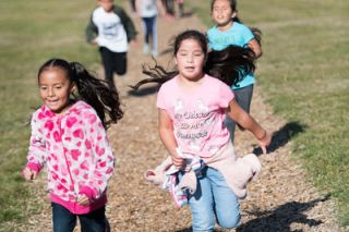 News-Register file photo##Columbus Elementary School students run laps on the school fitness trail. They ll be studying from home in September, but teachers will encourage them to get up from their computers and engage in physical activity, too.