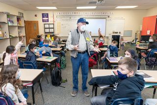 Marcus Larson/News-Register##Ken Dollinger leads a lesson on the lifecycle of fish.