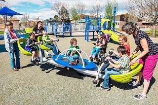 Submitted photo##The We-Saw invites kids and families of all ages and abilities to participate by featuring a gentle rocking motion. It’s one of several pieces of barrier-free playground equipment the city is seeking to include at the NW Neighborhood Park.