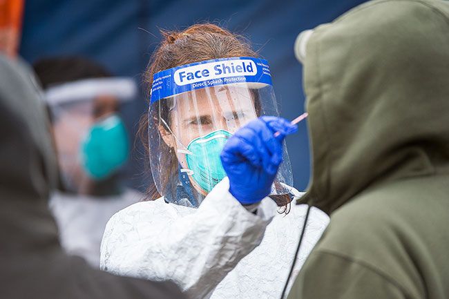 Marcus Larson/News-Register##Health care workers administered COVID-19 tests and flu shots Tuesday at St. James Catholic Church during a free clinic offered by Virginia Garcia Memorial Health Center and other providers.