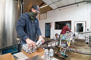 Marcus Larson/News-Register ##Julian Barton and Anthony Gibson with Vice Canning Inc. work to package the first run of ForeLand Beer, featuring a pilsner and IPA. Foreland takes over the location of Allegory Brewing, which closed earlier this year. Allegory owner David Sanguinetti is a partner in the new brewery with Sean Burke, former head brewer at Von Ebert Brewing. Marcus Larson/News-Register ##Julian Barton and Anthony Gibson with Vice Canning Inc. work to package the first run of ForeLand Beer, featuring a pilsner and IPA. Foreland takes over the location of Allegory Brewing, which closed earlier this year. Allegory owner David Sanguinetti is a partner in the new brewery with Sean Burke, former head brewer at Von Ebert Brewing.