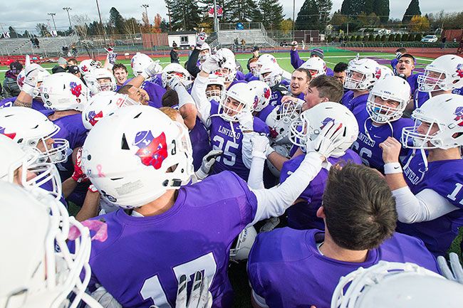 Marcus Larson/News-Register##
Linfield s Wildcat football team celebrate its first round, 27-13, DIII playoff victory over Hardin Simons at Maxwell Field.