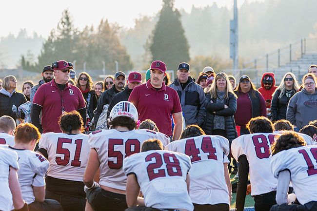 Rachel Thompson/News-Register##Jacob Peterson speaks with his team after their season-ending loss to Cascade Christian. In Peterson’s third season, the Pirates finished 9-3.