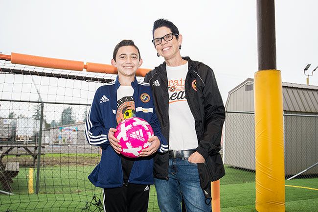 Marcus Larson/News-Register  ## Lucas Partin and his mom, Michelle, are thankful to be able to spend time at the Yamhill Carlton Soccer Club’s arena in downtown Carlton. In addition to playing there, Lucas, a seventh-grader, helps coach younger kids.