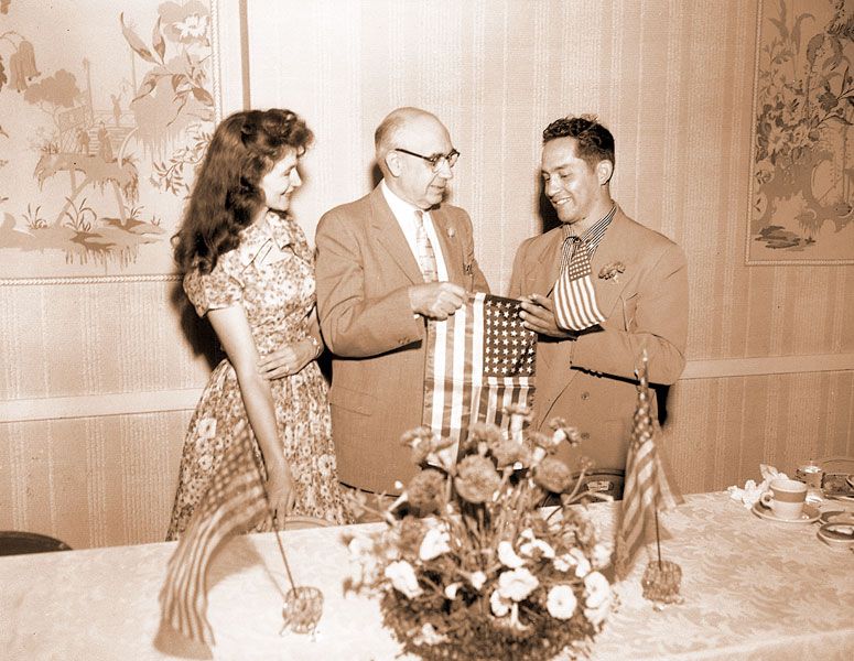 News-Register file photo ##  In 1958, Circuit Judge Arlie G. Walker presents an award to Ruben Contreras Sr., right, and his wife, Alberta Contreras. Their son, Ruben Jr., is thankful for the impact his late parents had in McMinnville, especially for his dad’s positive influence on the migrant community.