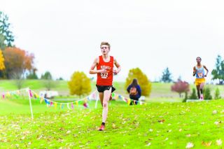Marcus Larson/News-Register file photo##
McMinnville’s lead cross country runner Kyle Spencer pushes toward the finish line of the Class 6A Pacific Conference Championships last month.