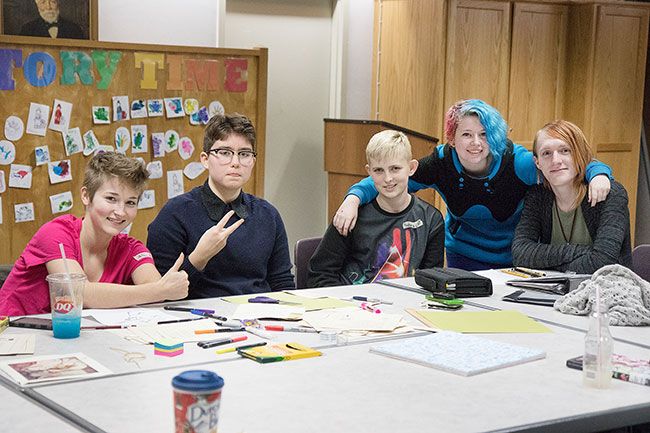 Helen Lee/News-Register##From left: LGBTQ support group members Idhunn Stiller, Zane Downs, Skylar, Theo, and group leader Kathryn Howd pose during their monthly meeting held Nov. 18.