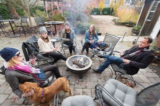 News-Register file photo##Patrons enjoy wine next to the fire in the 2018 scene at Elizabeth Chambers Cellar in McMinnville.