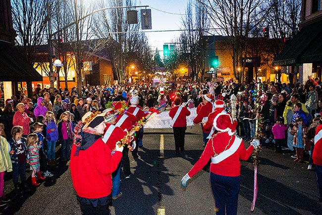 Marcus Larson / News-Register##Crowds cheer as parade entries march west on Third Street.