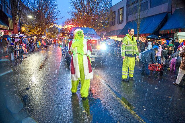 Rusty Rae/News-Register##One of several Grinches who visited McMinnville during the annual Downtown Thanksgiving parade. All who attended braved the start of weekend showers