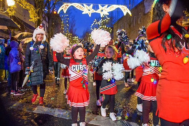 Rusty Rae/News-Register##Members of the Mac Cheer Club were a part of the McMinnville Thanksgiving Parade. From the left, parent helper Stephanie Rudolph, Mini Team member Evie Rudolph, and Rookie Team member Hunter Herckt, along with the rest of the squad.