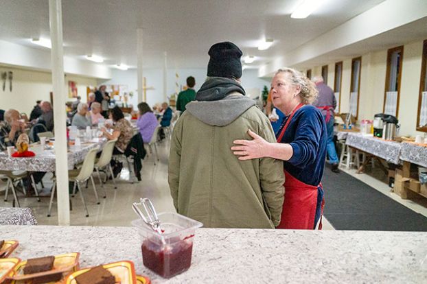 Rachel Thompson/News-Register
##
Robin Miguel, manager of the soup kitchen, talks with a regular customer as he arrives for Thanksgiving dinner. Diners said they are grateful for the soup kitchen and other services that make their lives easier in McMinnville.

 