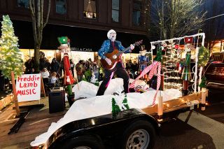 Marcus Larson/News-Register##
Local musician Freddie Lamb plays Feliz Navidad and other Christmas songs for the cheering crowd as he travels down Third Street in this year s Santa s Parade. Marcus Larson/News-Register##
Local musician Freddie Lamb plays Feliz Navidad and other Christmas songs for the cheering crowd as he travels down Third Street in this year s Santa s Parade.