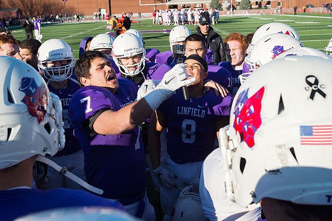 Marcus Larson/News-Register
The Linfield Wildcats celebrate another playoff win after the game.