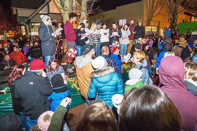 Marcus Larson/News-Register##
The McMinnville High School Twilighters perform Christmas carols fro the crowd during the post parade tree lighting ceremony.