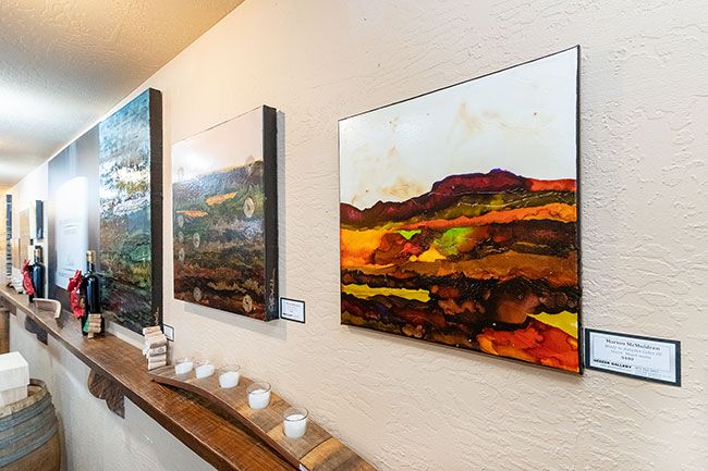 Marcus Larson/News-Register##Paintings created by artist Marion McMuldren of the Geezer Gallery are on display in the Willamette Valley Vineyard McMinnville tasting room.