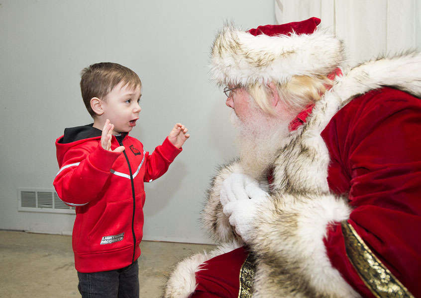 Marcus Larson / News-Register##Quin Shaw tells Santa he wants a big gorilla for Christmas.