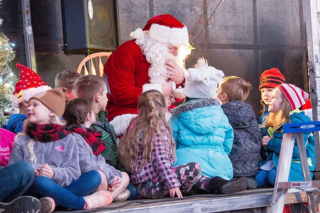 Marcus Larson / News-Register##Santa visits with children in Carlton.