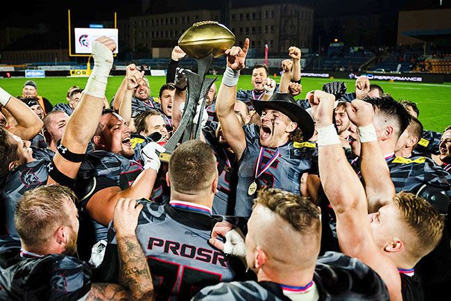 Petr Milfait/submitted photo##
Former Linfield quarterback Clark Hazlett (center, wearing cowboy hat) won the Czech Bowl last month as a member of Vysocina Gladiators in the Czech League of American Football.