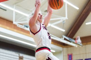 Marcus Larson/News-Register##
McMinnville point guard Luke Arzner rattles the rim with an alley-oop slam during last Friday’s 64-59 Grizzy win over Centennial. Arzner dropped 32 points in the victory. Marcus Larson/News-Register##
McMinnville point guard Luke Arzner rattles the rim with an alley-oop slam during last Friday’s 64-59 Grizzy win over Centennial. Arzner dropped 32 points in the victory.
