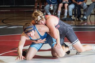 Rusty Rae/News-Register##
McMinnville 195-pounder Tommy Bates locks in a tight grip on Liberty’s Dakota Jensen. Bates eventually won the match by an 8-1 decision. Rusty Rae/News-Register##
McMinnville 195-pounder Tommy Bates locks in a tight grip on Liberty’s Dakota Jensen. Bates eventually won the match by an 8-1 decision.