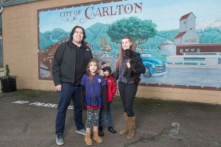 Rusty Rae/News-Register##Brazil native Guilherme Brandao and his family, daughter Aline, son Rafael and wife Julie, have lived in Carlton four years. He became a citizen in June and was elected to the city council in November.