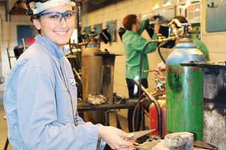 Submitted photo##Carly Loving, senior at McMinnville High School, works on a welding project.