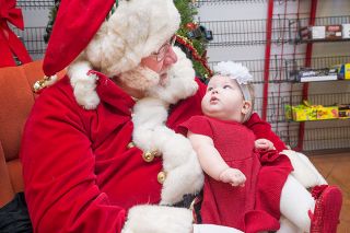 Marcus Larson/News-Register##
Six-month-old Ryssa Shultz takes a inquiring look back at Santa Claus (Darrell Murphy) after being placed in his lap for a photo at the Reel Hollywood Video Meet Santa event. Marcus Larson/News-Register##
Six-month-old Ryssa Shultz takes a inquiring look back at Santa Claus (Darrell Murphy) after being placed in his lap for a photo at the Reel Hollywood Video Meet Santa event.