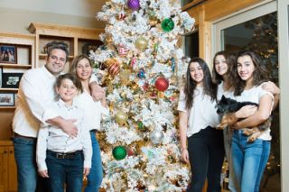 Rusty Rae/News-Register##The Gigenas gather around their white flocked tree. At left are dad Manuel, mom Nevenka and son Mateo. At right are daughters Ariana, Kyara and Malia. Rusty Rae/News-Register##The Gigenas gather around their white flocked tree. At left are dad Manuel, mom Nevenka and son Mateo. At right are daughters Ariana, Kyara and Malia.